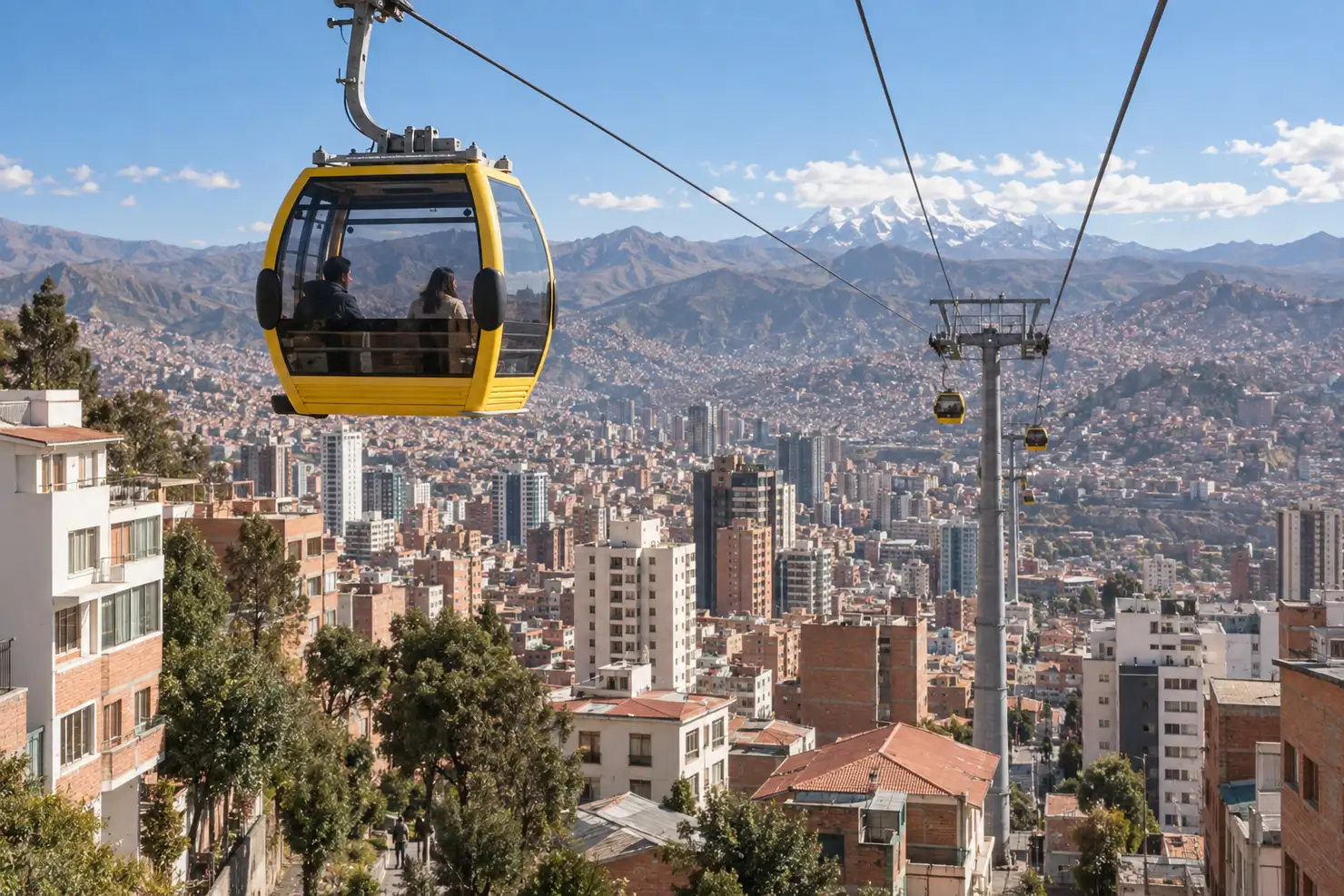 A yellow cabin of the Yellow Line of Mi Teleférico rising over Sopocachi's rooftops, the bowl of the city below