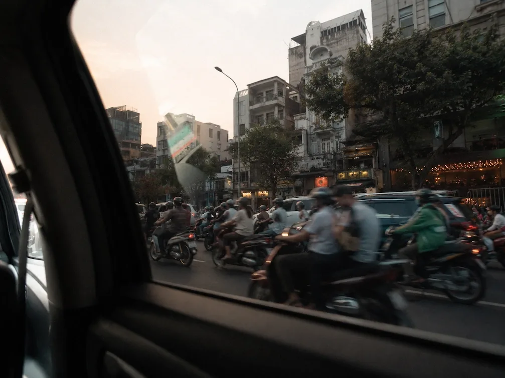 The view from a car window of Ho Chi Minh City motorbike traffic on the ride in from the airport